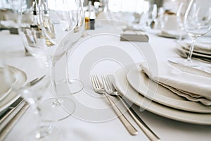 Served table in restaurant with dishes and glasses