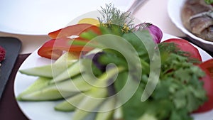 Served table with sausage and meat and vegetable cuts. Slow motion