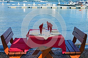 Served table on sea beach restaurant of Budva, Montenegro