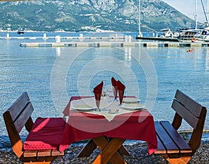 Served table on sea beach restaurant of Budva, Montenegro