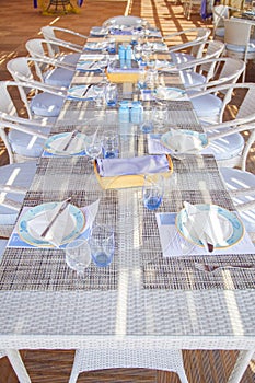 Served table on the summer terrace of the restaurant