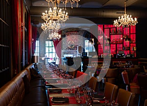 Served tables in banquet room of luxurious restaurant