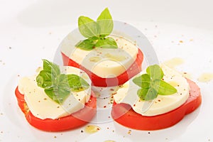 Served tomato with mozzarella and basil