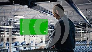 Server farm programmer using green screen computer to scan hardware rigs