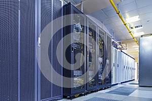 Server internet datacenter room with rows of modern mainframes. Server control center for internet provider. Network and