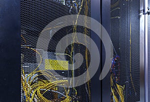 Server rack cluster in data center. Network server room with servers high performance computers running processes