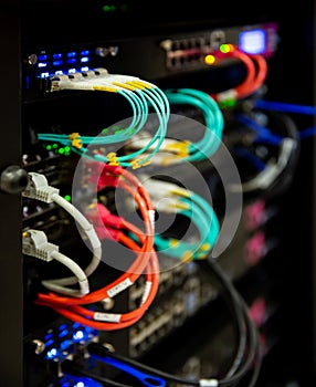 Server rack with internet cord cables in server room