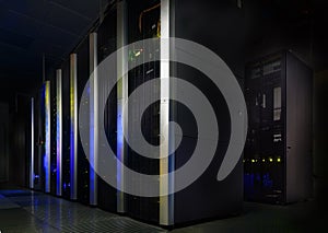 Server room in dark, with bright colored lights motion