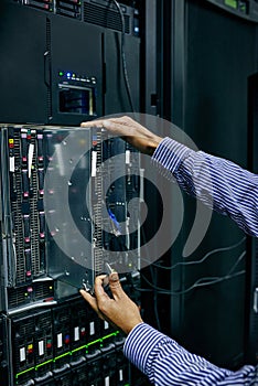 Server room, hardware or hands of technician fixing online cybersecurity glitch, machine or servers system. IT support