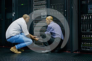 Server room, men or technicians talking about hardware together for a cybersecurity glitch with teamwork. IT support