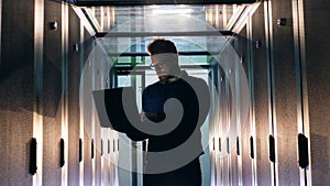 Server room with a support engineer operating a computer