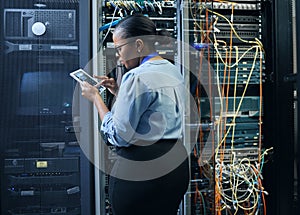 Server room, woman and engineer with tablet for cybersecurity, programming or cable maintenance. Black female technician
