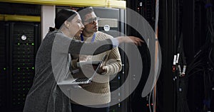 Server room, woman and man with tablet, laptop and network administration, teamwork for digital update. Tech employees