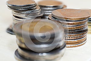 Serveral coin stacks on white background.