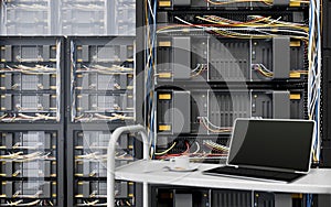 Servers and hardware room with notebook and coffee cup computer technology closeup photo