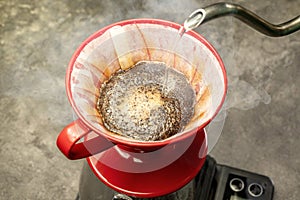 Serves coffee with a V60 dripper coffee maker photo