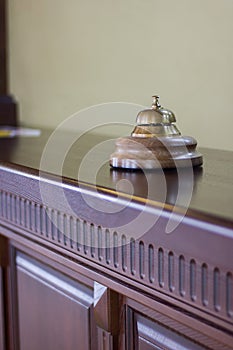 Service bell in a hotel reception for concierge alarm on desk.