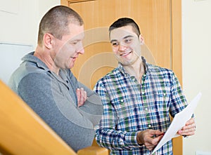 Service employee with tenant at doorway