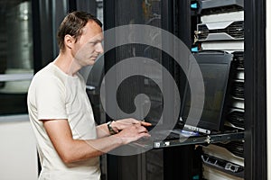 Service engineer in server room