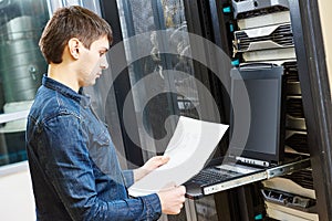 Service engineer in server room