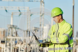 Service engineer working with laptop at heat electric power station