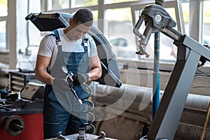 Service man working in a car repair shop