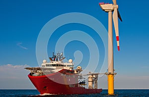 Service operational vessel standing by wind turbine