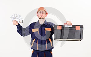 Service and payment concept. Man with toolbox got salary, money