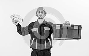 Service and payment concept. Man with toolbox got salary, money