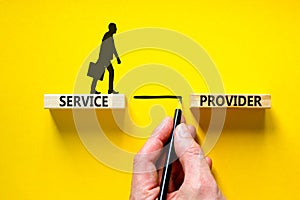 Service provider symbol. Concept words Service provider on wooden blocks on a beautiful yellow table yellow background.