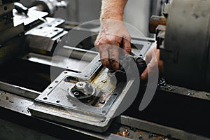 Service and repair of machine tools in a machine shop or workshop.