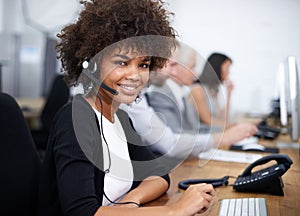 Service with a smile. Portrait of an attractive young female call center operator.