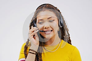 Service with a smile. Studio shot of an attractive young female customer service representative wearing a headset