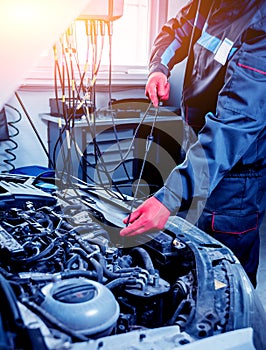 Service station. Car repair wiring. Engine Auto service