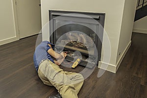 Service technician working on a fireplace