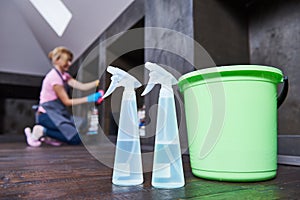 Service woman cleaning home