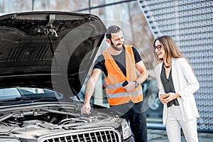 Service worker with businesswoman and car