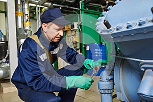 Service worker at industrial compressor station