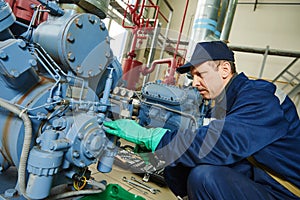 Service worker at industrial compressor station