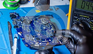 Service worker repairing personal computer board