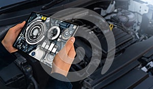 Serviceman repairing a car