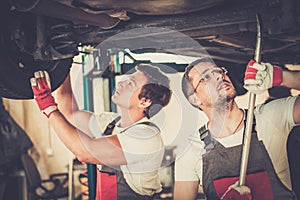 Servicemen in a car workshop