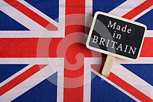 services concept - Great Britain country's flag, blackboard with text Made in Britain