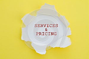 Services and pricing written under torn paper.