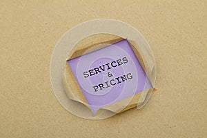 Services and pricing written under torn paper.