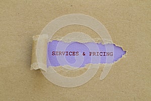 Services and pricing written under torn paper.