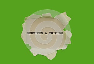 Services and pricing written under torn paper.