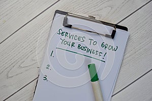 Services To Grow Your Business write on a paperwork and supported by additional services isolated on Wooden Table