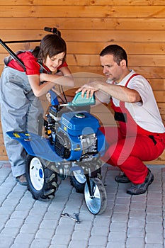 Servicing a small tiller machine