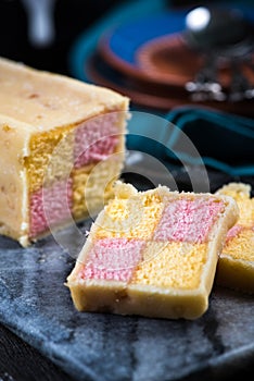 Serving Battenberg checked cake